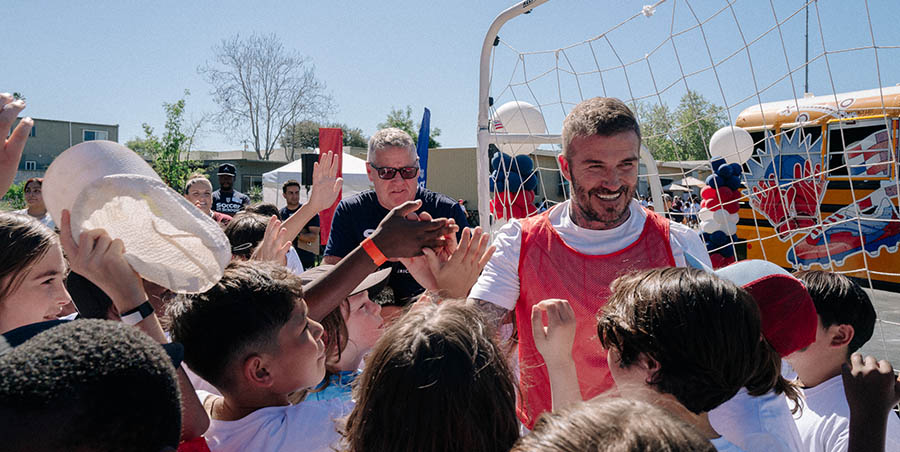 Sir David Beckham greets campers